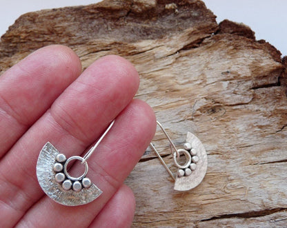 Sterling silver dangle fan earrings.