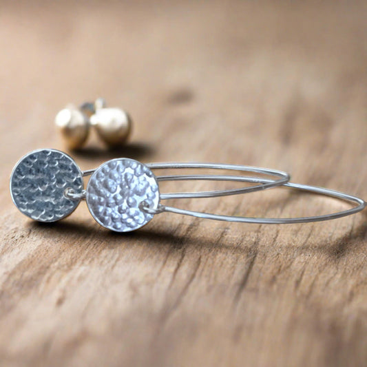 Hammerd sterling silver disc dangle earrings.