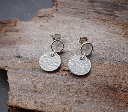 Sterling silver circle and hammered disc stud earrings.