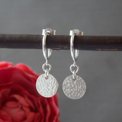 Sterling silver disc charm half hoop earrings.