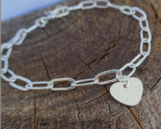 Sterling silver heart charm bracelet.