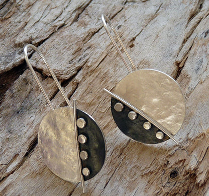 Large sterling silver disc earrings.