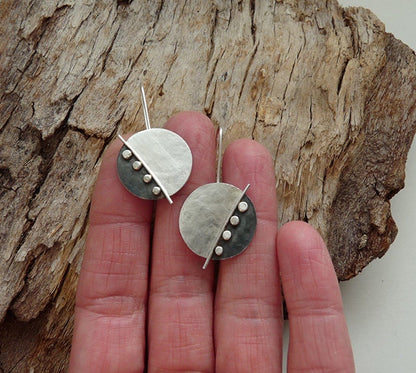 Large sterling silver disc earrings.