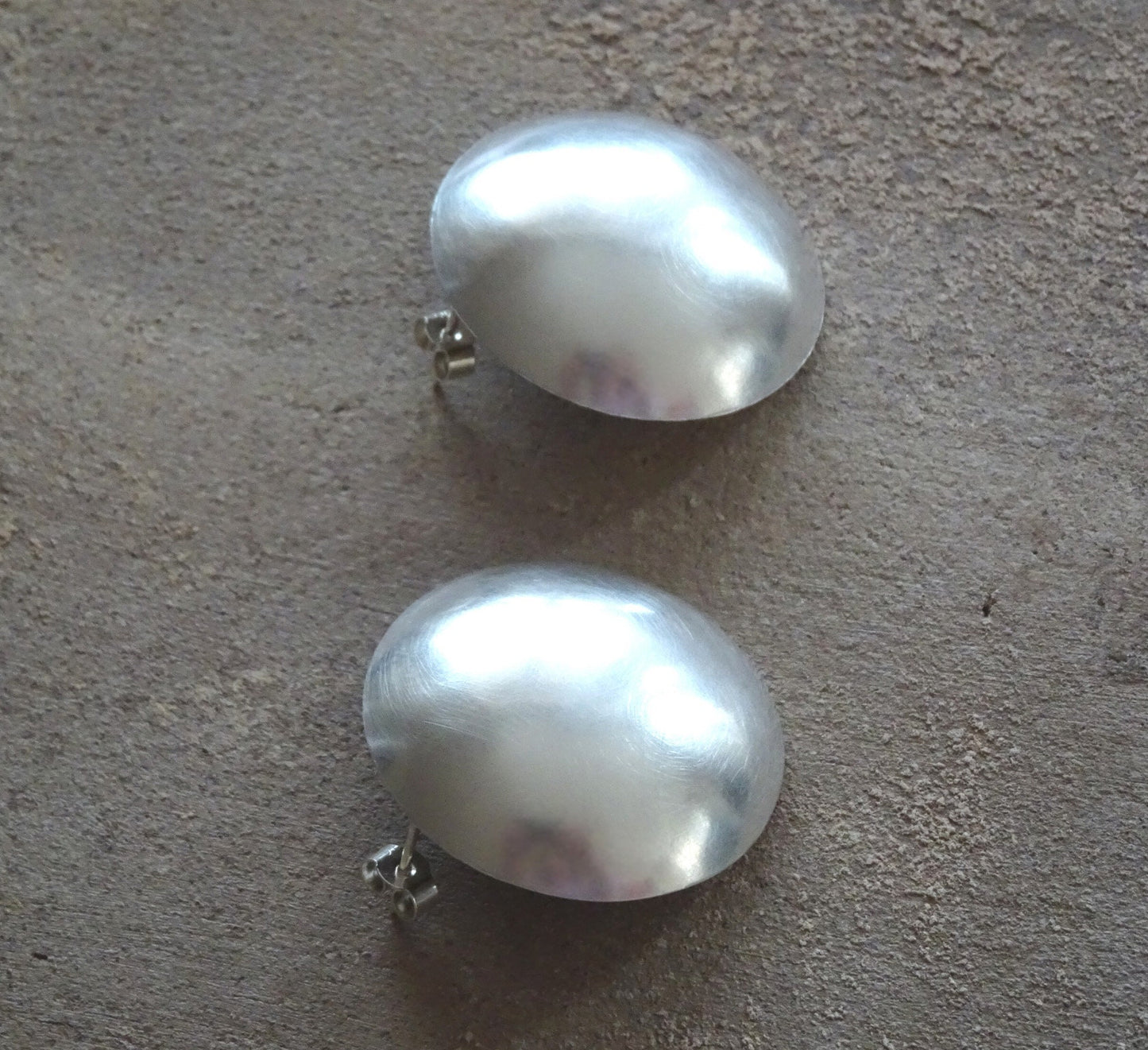 Large statement sterling silver bowl stud earrings.