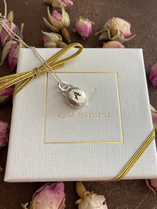 Pebble solid sterling silver personalised letter necklace.