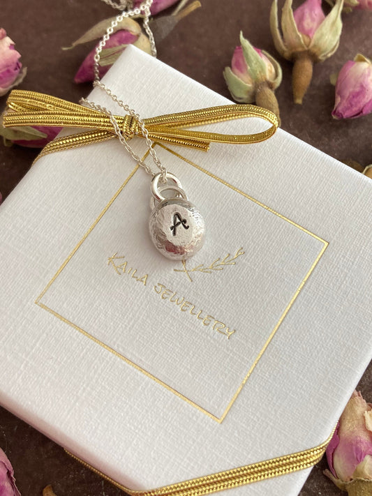 Pebble solid sterling silver personalised letter necklace.