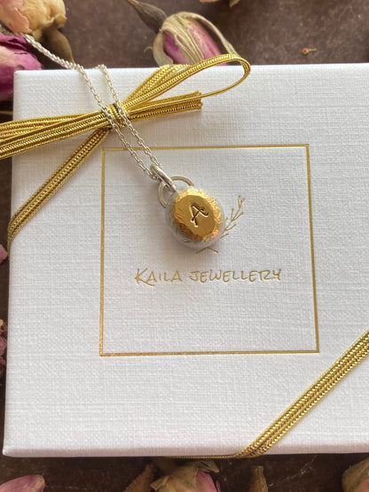 Personalised initial organic sterling silver pebble necklace.