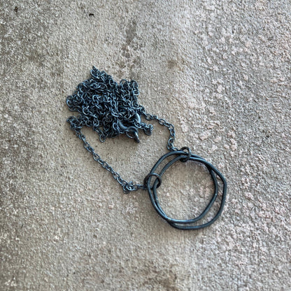Oxidised sterling silver irregular two interlocking circle necklace.