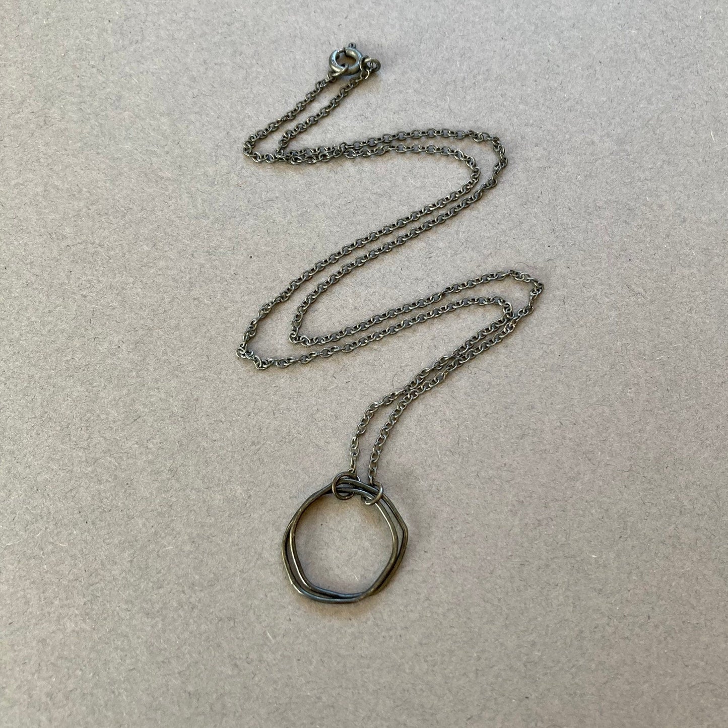 Oxidised sterling silver irregular two interlocking circle necklace.