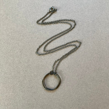 Oxidised sterling silver irregular two interlocking circle necklace.