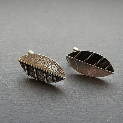 Sterling silver leaf stud earrings.