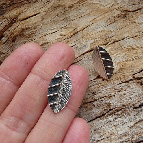 Sterling silver leaf stud earrings.