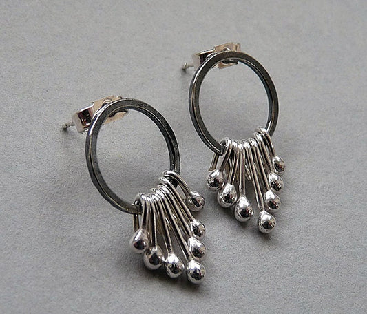 Sterling silver oxidised circle dangle studs.
