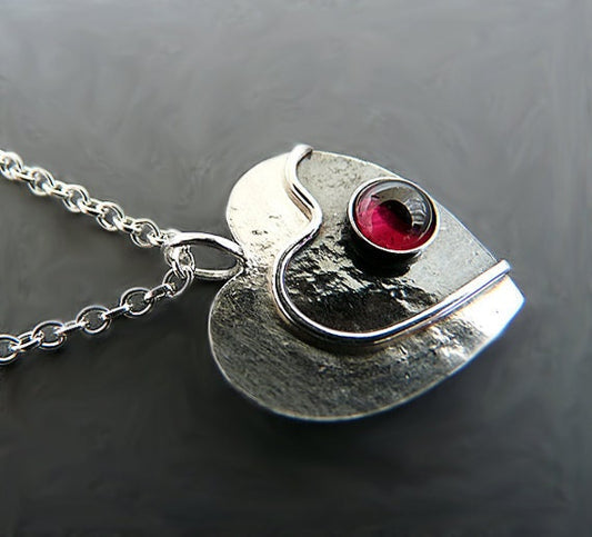 Garnet heart sterling silver necklace.