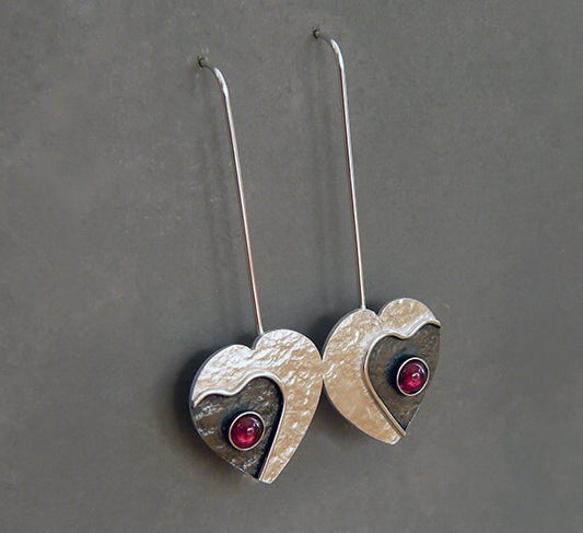 Garnet sterling silver heart earrings.