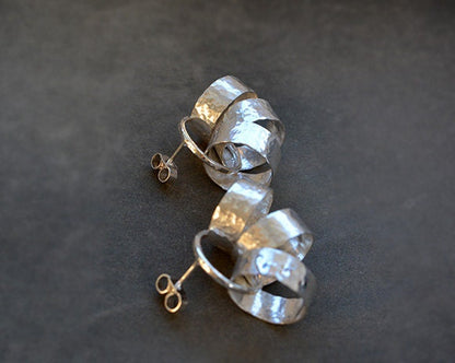 Sterling silver circle stud earrings.