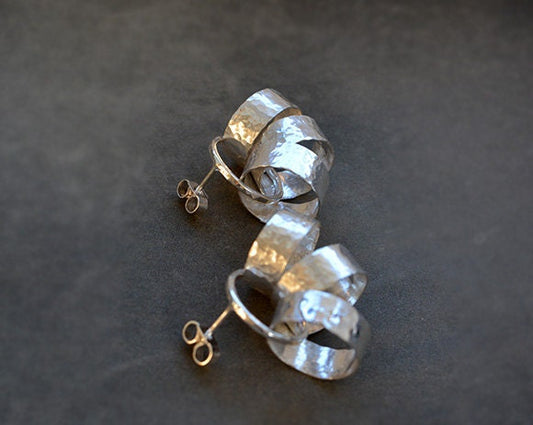 Sterling silver circle stud earrings.
