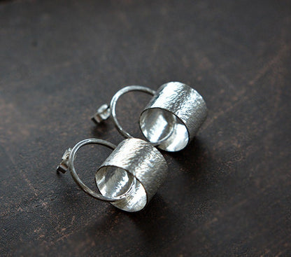 Sterling silver circle stud earrings.