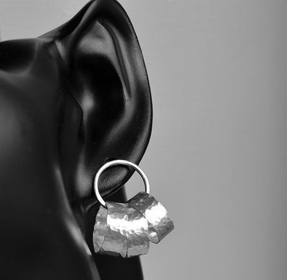 Sterling silver circle stud earrings.