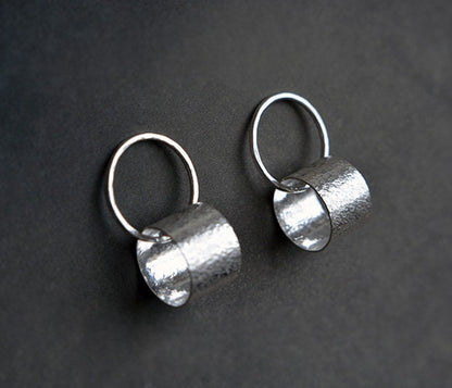 Sterling silver circle stud earrings.