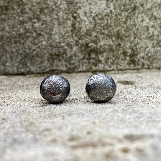 Oxidised sterling silver pebble stud earrings.