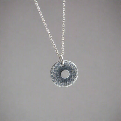 Hammered disc, sterling silver necklace.