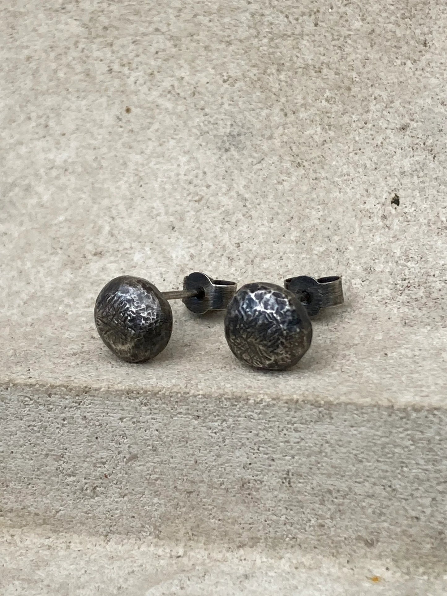 Oxidised sterling silver pebble stud earrings.